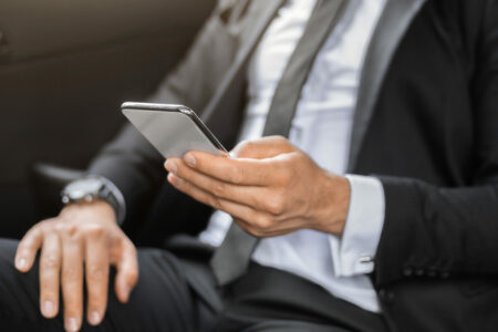 Unrecognizable Businessman Using Mobile App On Smartphone