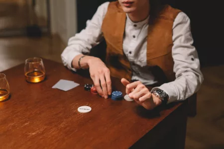 Person Holding Poker Chips